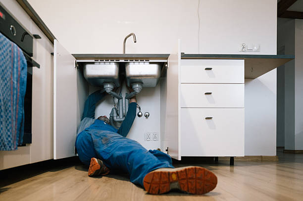 Professional Drain Cleaning technician working in Cerrillos, NM